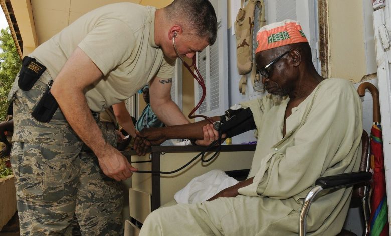 nurse checking a patient's blood pressure