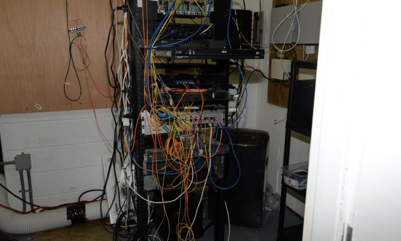 blue network cables organised in a server room