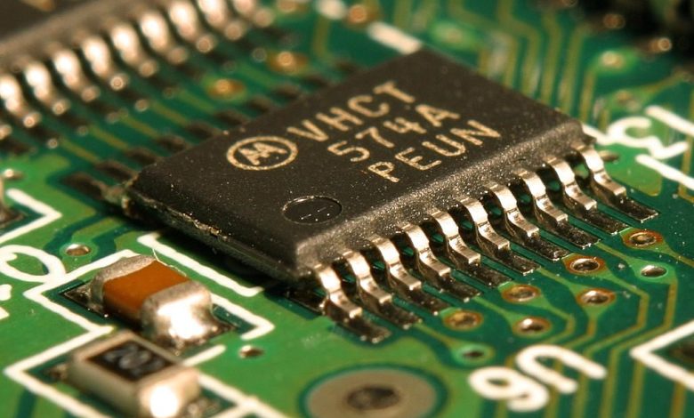 A microchip and circuit board in close view