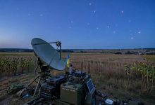 Satellite communications terminal in Ukraine with satellites visible in the evening sky